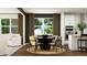 Stylish dining area with round table and chairs, adjacent to a bright, modern kitchen at 243 Deer Valley Run, Canton, GA 30115
