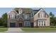 Stunning two-story brick home featuring attached garage and a well manicured lawn at 243 Deer Valley Run, Canton, GA 30115