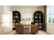 Comfortable home office with arched shelving, decorative rug, and wood desk at 243 Deer Valley Run, Canton, GA 30115
