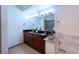 Bathroom features dual sinks, granite countertops, and a shower/tub combo with marble tiling at 390 17Th Nw St # 2040, Atlanta, GA 30363