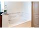 Bathroom with a bathtub and marble tiled backsplash at 390 17Th Nw St # 2040, Atlanta, GA 30363