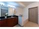 Bathroom features a sink with granite countertop, a tub with marble tiling, and linen closet at 390 17Th Nw St # 2040, Atlanta, GA 30363