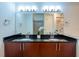 Modern bathroom with dual sinks, granite countertops, and a large mirror at 390 17Th Nw St # 2040, Atlanta, GA 30363