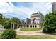 Beautiful courtyard with manicured lawns, an arched landmark, and lush landscaping at 390 17Th Nw St # 2040, Atlanta, GA 30363