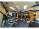 Well-equipped gym with various cardio machines, weights, mirrors, and bright lighting at 390 17Th Nw St # 2040, Atlanta, GA 30363