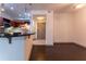 Modern kitchen with a breakfast bar featuring granite countertops and stainless steel appliances at 390 17Th Nw St # 2040, Atlanta, GA 30363