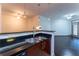 Open kitchen bar overlooking living room with hardwood floors at 390 17Th Nw St # 2040, Atlanta, GA 30363