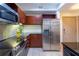 Modern kitchen with stainless steel appliances and dark wood cabinets at 390 17Th Nw St # 2040, Atlanta, GA 30363