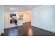 Open-concept living area with hardwood floors and stainless steel kitchen at 390 17Th Nw St # 2040, Atlanta, GA 30363