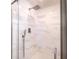 Contemporary bathroom featuring a glass-enclosed shower with marble tiling and modern fixtures at 390 17Th Nw St # 2040, Atlanta, GA 30363