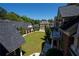 Expansive backyard showcasing manicured lawns and mature trees, complemented by the architectural details of the estate at 4790 Shallowford Rd, Roswell, GA 30075