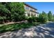 Beautifully landscaped home featuring mature trees, a circular driveway, and a covered front porch, adding to its charm at 4790 Shallowford Rd, Roswell, GA 30075