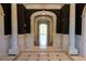 Elegant foyer with marble floors, soaring arches, and decorative columns creates a grand and welcoming entrance at 4790 Shallowford Rd, Roswell, GA 30075