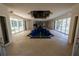 Unique indoor pool area featuring ample natural light and access to outdoor space, creating a resort-like ambiance at 4790 Shallowford Rd, Roswell, GA 30075