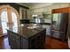 Spacious kitchen with a large island, stainless steel appliances, and gray cabinets at 4790 Shallowford Rd, Roswell, GA 30075