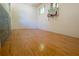 Full view of indoor racquetball court with hardwood floors, a glass wall, and a basketball hoop on the back wall at 4790 Shallowford Rd, Roswell, GA 30075