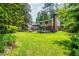 Large backyard with a view of the house and entertainment deck at 6505 Whispering Ln, Atlanta, GA 30328