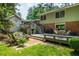 Spacious backyard with an entertainment deck and outdoor seating at 6505 Whispering Ln, Atlanta, GA 30328
