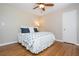 Cozy bedroom featuring hardwood floors and a classic ceiling fan at 6505 Whispering Ln, Atlanta, GA 30328
