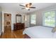 Spacious bedroom featuring hardwood floors and natural light at 6505 Whispering Ln, Atlanta, GA 30328