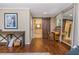 Spacious bedroom with hardwood floors, vanity, sliding barn door to ensuite bathroom, and decorative furnishings at 6505 Whispering Ln, Atlanta, GA 30328