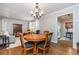 Dining room with hardwood floors connected to the living room at 6505 Whispering Ln, Atlanta, GA 30328