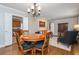Dining room connected to living room features a wooden table and chairs at 6505 Whispering Ln, Atlanta, GA 30328