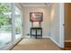 Hallway area with hardwood floors leading to a sliding glass door to the backyard at 6505 Whispering Ln, Atlanta, GA 30328