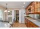 Bright kitchen featuring granite countertops, ample cabinet space, and a dining area at 6505 Whispering Ln, Atlanta, GA 30328