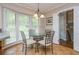 Charming breakfast nook bathed in sunlight, featuring a glass table and comfortable seating at 6505 Whispering Ln, Atlanta, GA 30328