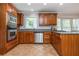 Well-appointed kitchen featuring stainless steel appliances and beautiful wooden cabinetry at 6505 Whispering Ln, Atlanta, GA 30328