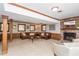 Bright living room with a brick fireplace, wood trim and large windows offering plenty of natural light at 6505 Whispering Ln, Atlanta, GA 30328