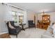 Living room with hardwood floors, decorative windows and an elegant chandelier at 6505 Whispering Ln, Atlanta, GA 30328