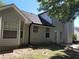 Backyard with light gray siding and modern architecture at 1752 Spring Hill Cv, Lithonia, GA 30058