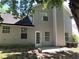 Backyard with patio of a home with light gray siding at 1752 Spring Hill Cv, Lithonia, GA 30058
