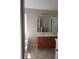 Bathroom featuring double sink vanity and tub at 1752 Spring Hill Cv, Lithonia, GA 30058