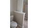 Close-up of a toilet in a bathroom featuring a privacy wall at 1752 Spring Hill Cv, Lithonia, GA 30058