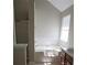 Bathroom with a separate tub and vanity area at 1752 Spring Hill Cv, Lithonia, GA 30058