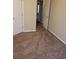 This bedroom is carpeted with a doorway that allows natural light at 1752 Spring Hill Cv, Lithonia, GA 30058