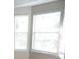 Bright bedroom featuring a large window that provides natural light at 1752 Spring Hill Cv, Lithonia, GA 30058