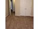 This bedroom is carpeted and has large closet doors at 1752 Spring Hill Cv, Lithonia, GA 30058