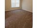 Bedroom with neutral carpet and a window for natural light at 1752 Spring Hill Cv, Lithonia, GA 30058