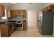 Modern kitchen with stainless steel appliances and tile flooring at 1752 Spring Hill Cv, Lithonia, GA 30058