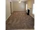 Open living room features a fireplace and neutral carpeting at 1752 Spring Hill Cv, Lithonia, GA 30058