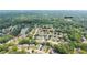Aerial view of the community featuring a lake, pool, tennis courts, and houses at 2324 Littlebrooke Ln, Dunwoody, GA 30338