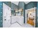 Bathroom boasts a spacious vanity with dual sinks, a walk-in closet, and a doorway to the main bedroom at 2324 Littlebrooke Ln, Dunwoody, GA 30338