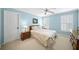 Cozy bedroom with blue walls, plush carpet, and plantation shutters at 2324 Littlebrooke Ln, Dunwoody, GA 30338