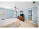 Relaxing bedroom with neutral carpet, dresser, and plantation shutters at 2324 Littlebrooke Ln, Dunwoody, GA 30338