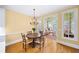 Dining room features hardwood floors and leads into the living room, offering an open floor plan concept at 2324 Littlebrooke Ln, Dunwoody, GA 30338
