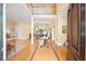Bright foyer with soaring ceilings, hardwood floors, a view of the living room, and a staircase to the second floor at 2324 Littlebrooke Ln, Dunwoody, GA 30338